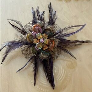 Elegant Feathered Brooch with Floral Center